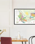 The De Long Wine Map of South Africa Framed hangs above a small dining table with two chairs and a glass carafe.