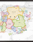 The Wine Map of Spain & Portugal IGPs Framed displays vibrant wine regions, including IGPs, with labeled borders, cities, and seas. Features a legend and scale—ideal as a stylish wood-framed display for wine enthusiasts.