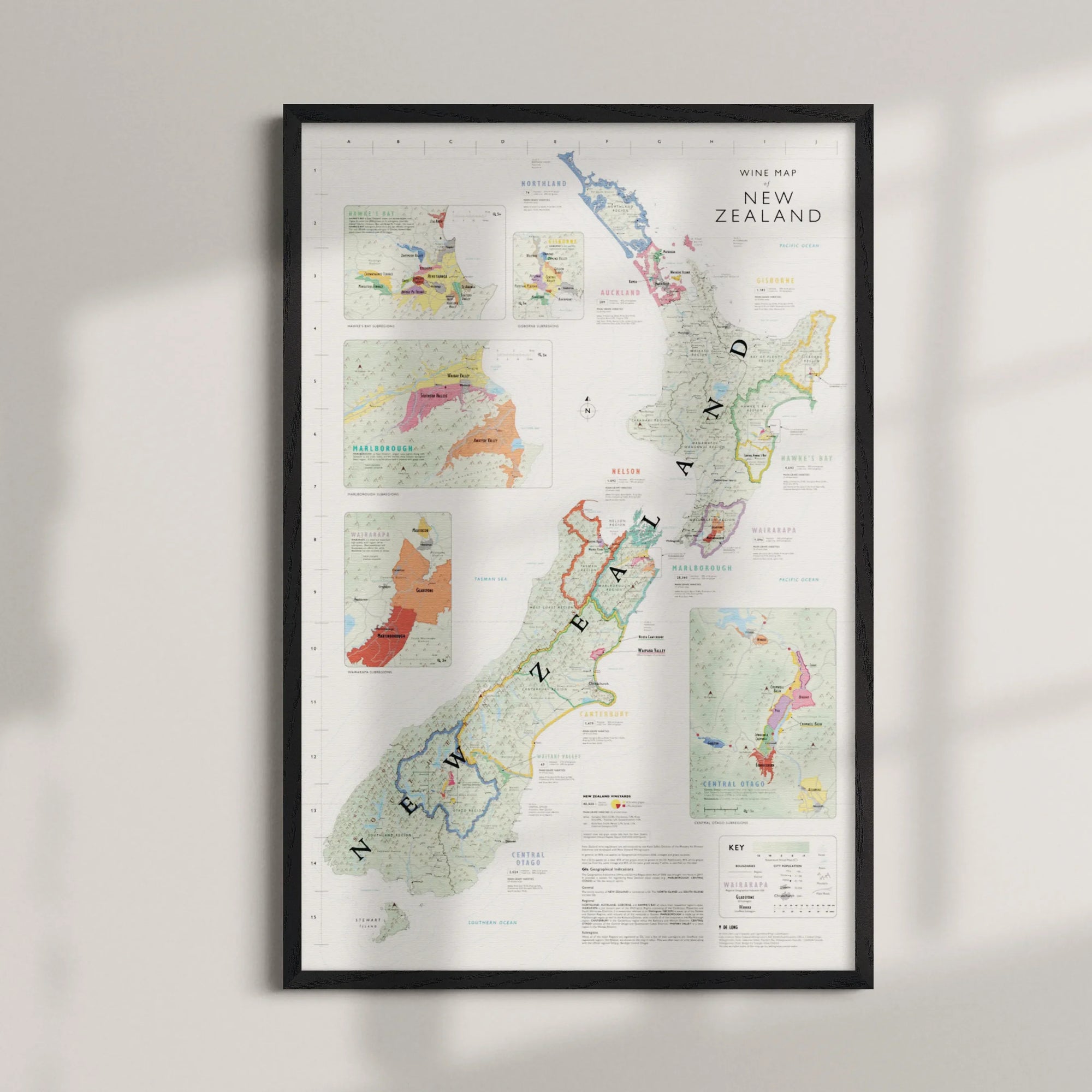 The Wine Map of New Zealand Framed features vibrant wine regions with detailed insets and an elegantly displayed title at the top right, all set in a high-quality wood frame.