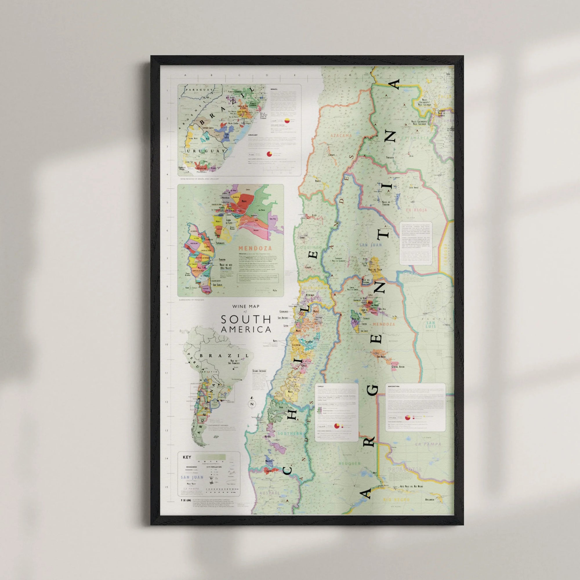 Wine Map of South America Framed showcases Argentina and Chile's wine regions, with insets for Mendoza, Patagonia, and more. Features color-coded vineyard markers and descriptions. Wood frame adds an elegant touch.