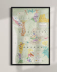 The Wine Map of the Pacific Northwest Framed is displayed on a wall, featuring Oregon, Washington, and part of British Columbia with colorful regional markings and text labels.